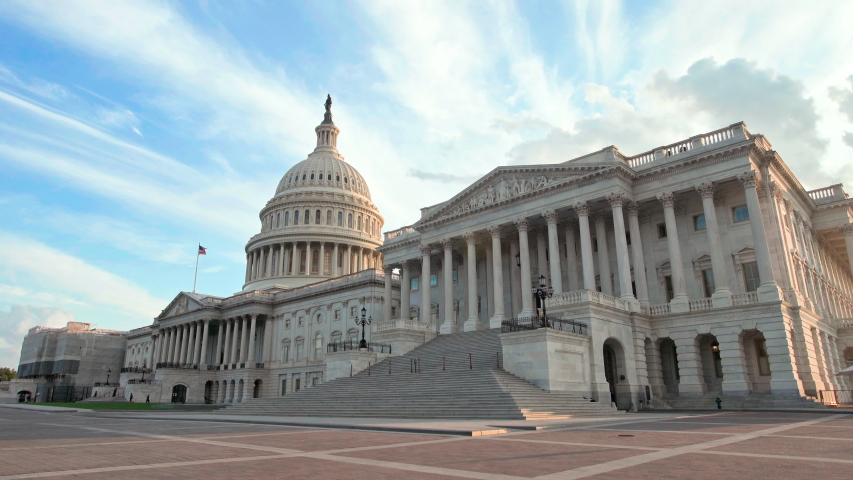 Hero shot of the United States of America (US) National Capitol Building in the Nation's capital, Washington, District of Columbia (DC.) This landmark is located in the Capitol Hill / National Mall. Royalty-Free Stock Footage #1034569823