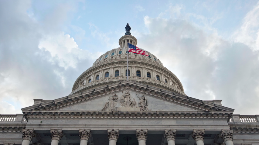 Hero shot of the United States of America (US) National Capitol Building in the Nation's capital, Washington, District of Columbia (DC.) This landmark is located in the Capitol Hill / National Mall. Royalty-Free Stock Footage #1034569826