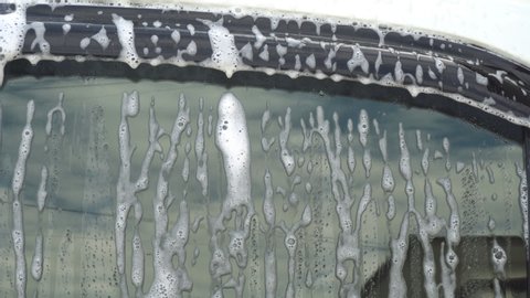 Close up of water Side mirror with foam in  CarWash and Self wash Service