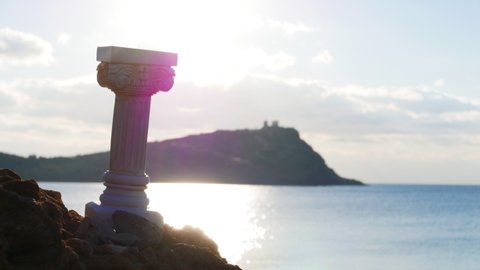Greece Cape Sounion. Single greek column on sea shore and ruins of an ancient temple of Poseidon in the background time lapse 4K