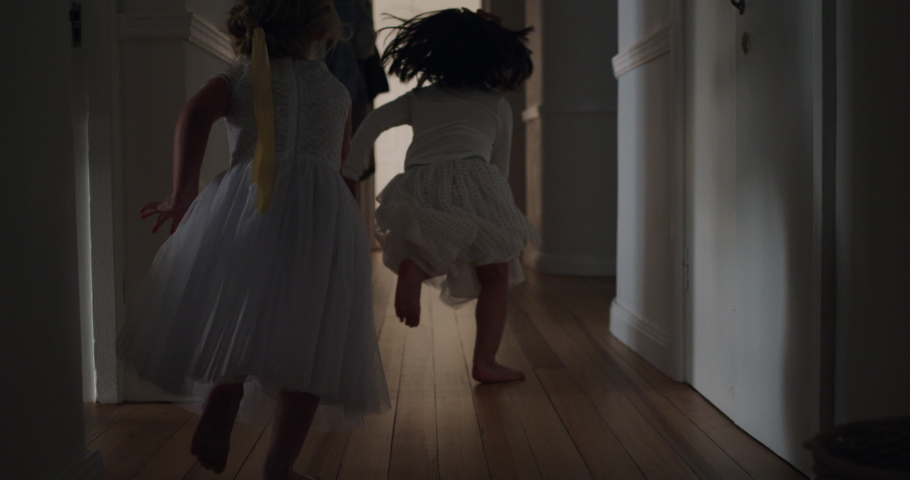 happy little girls running through house playing game of catch wearing tutu excited children enjoying childhood fun on weekend morning 4k Royalty-Free Stock Footage #1034590916