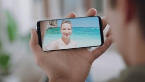 young man having video chat using smartphone girlfriend on vacation beach in italy sharing travel experience having fun on holiday chatting with mobile phone 4k footage
