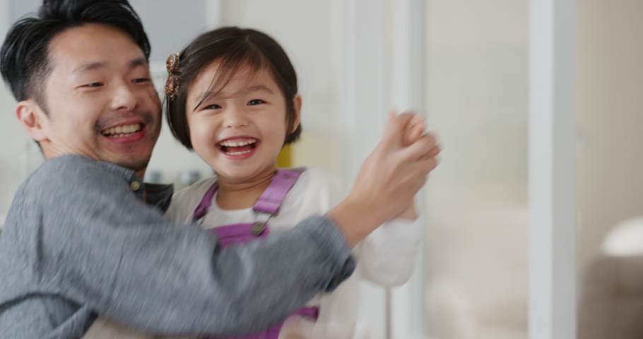 happy asian family dancing in kitchen father enjoying dance with daughter little girl laughing enjoying exciting weekend at home 4k footage Royalty-Free Stock Footage #1034597687