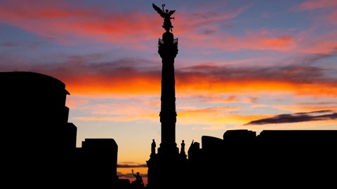 Mexico City: The Angel of Independence, Timelapse at Twilight with Colorfull Clouds and Skyline of City, Mexico