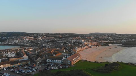 Sunset over St Ives, Cornwall with view of Porthmeor Beach and the town from 'The Island'
