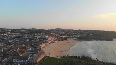Sunset over St Ives, Cornwall with view of Porthmeor Beach and the town from 'The Island'