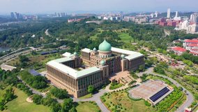 4K UHD Aerial Footage Of Perdana Putra Complex Putrajaya Malaysia. Located On The Main Hill In Putrajaya, The Natural Stone Clad Building With Its Green Pitched Roof And Onion-Shaped Main Dome. 