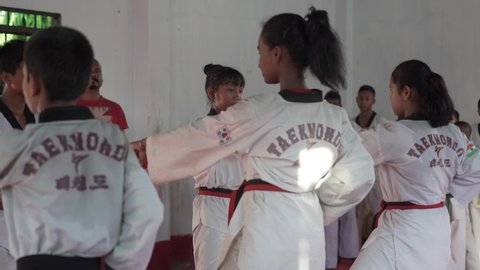 Naharkatia Assam / India - 07 03 2019: Young man and women practicing the martial arts indoor. Karate Taekwondo