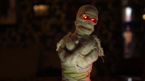 Halloween Mummy Doll dancing. Eyes glowing. For Celebration Parties.