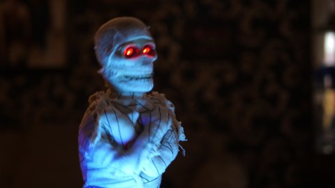 Halloween Mummy Doll dancing. Eyes glowing. For Celebration Parties.