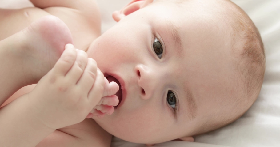 Closeup view of adorable little child on bed
