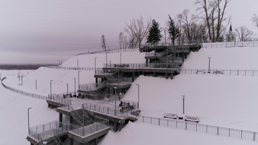 view of a staircase leading up to the top of the hillNagorny Park. City of Barnaul, Siberia, Russia.