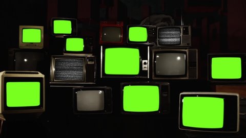 Stacked retro TVs turning on Green Screens. You can replace green screen with the footage or picture you want with “Keying” effect in AE (check out tutorials on Internet).