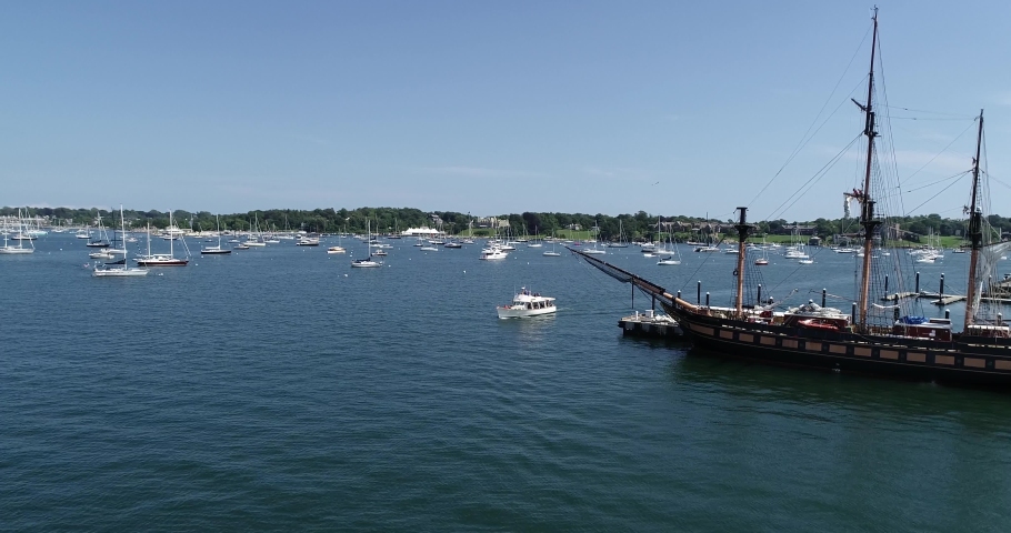 conic Newport Rhode Island scenery is enjoyed by a boat load of tourists near Ft. Adams.