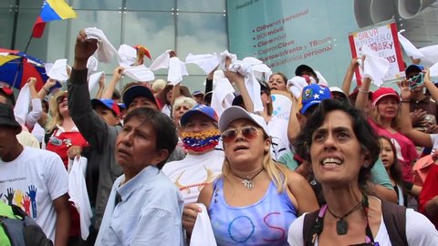Caracas, Venezuela July 5, 2019: Venezuelans gather to protest on Independence Day, convened by opposition leader Juan Guaido. The motto of the protest was No more torture human rights violations 