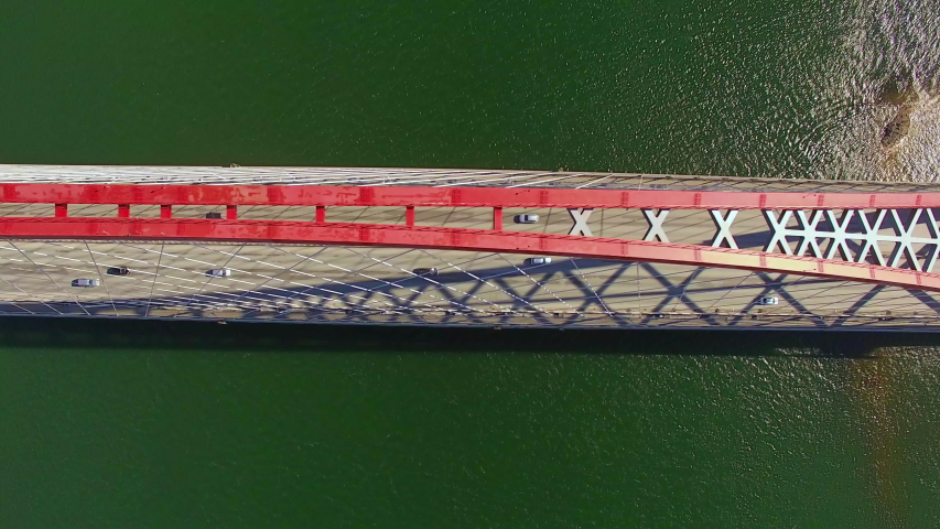 The top view Drone view of highway road and car bridge over water.