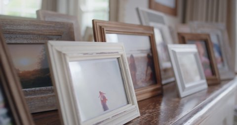 family photos picture frames on fireplace collection of photographs happy memories 4k