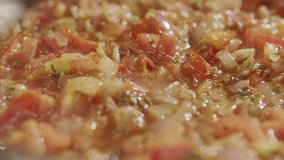 Vegetable stew stewed in frying pan. Slow motion video
