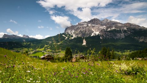 Beautiful panoramic view of the Cortina d'Ampezzo valley with the Tofane Group on background. Sexten Dolomites, Belluno. Italy. Timelapse, Static camera. 4K UHD Video.