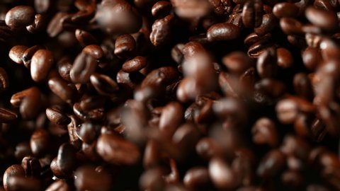 Super slow motion of flying coffee beans. Filmed on high speed cinema camera, 1000 fps.