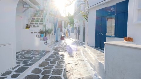 MYKONOS, GREECE - MAY 29, 2019: Walking with steadycam steadicam in picturesque narrow streets with traditional houses of Mykonos town in famous tourist attraction Mykonos island, Greece