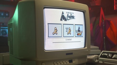 AOL connecting to the Internet in the 90s. It was taking time to get online back in the days. Retro style footage MONTREAL, CANADA - JULY 2019