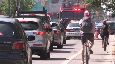 Toronto, Ontario, Canada July 2019 Bike lane on busy city street with car traffic gridlock in Toronto
