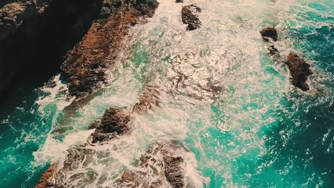 Aerial shooting 4K panoramic birds eye view on sea waves, Canary islands. Seascape coastline at sunny day. Travel, Beach, Nature, freedom concept. Waves, splashed drops.