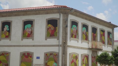Famalicão / Portugal - 07 23 2019: Famalicão, Portugal, July 23, 2019: "O Manto", colorful street art graffiti made by Ricardo Miranda and Joana Brito in "A casa ao Lado", Famalicão, Portugal.