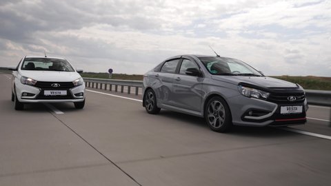 Minsk, Belarus - July 31, 2019: Lada Vesta Sport drives on a highway. Vesta Sport affordable russian car, it is designed using racing technology and adapted to daily trips in a city and on a highway.