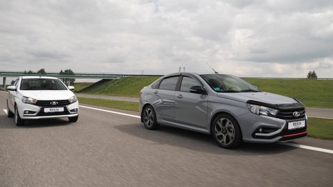 Minsk, Belarus - July 31, 2019: Lada Vesta Sport drives on a highway. Vesta Sport affordable russian car, it is designed using racing technology and adapted to daily trips in a city and on a highway.