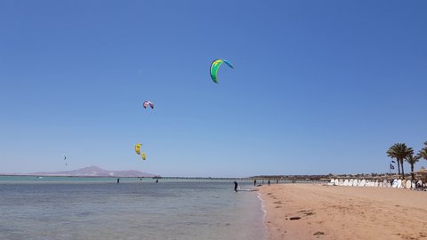 Egypt, Sharm El Sheikh - May 04,2019 kite surfers sail in the calm sea. windy weather on a sunny day
