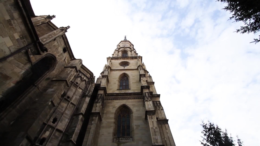 Low angle shot of the Saint Michael church tower in Cluj, Romania, main square 