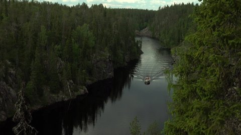 Boat on Julma-Ölkky, a canyon lake in Hossa National Park, Finland