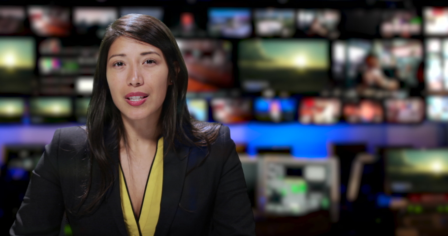 MS Female anchor speaking at news desk Royalty-Free Stock Footage #1034745584