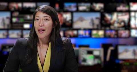 MS Female anchor speaking at news desk