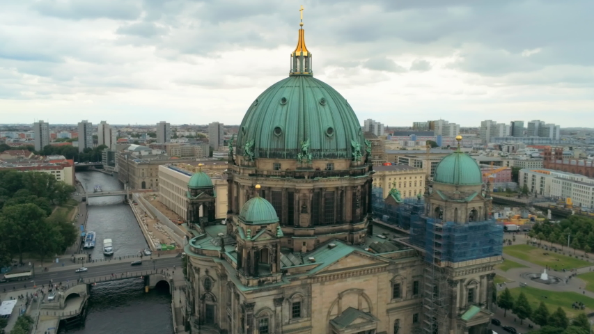 Berlin Cathedral Church - main evangelical church on Museum Island in the Mitte borough in Berlin, Germany, called Berliner Dom. 4K Aerial Panorama of European Capital Cityscape