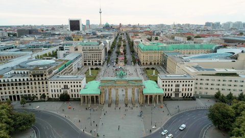 Aerial View of Brandenburg Gate (Brandenburger Tor) - monument in Berlin, Capital of Germany, Europe, with Skyline at the Background. 4K Zoom Out Shot of European City Landmark