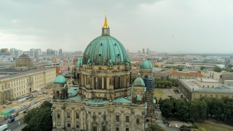 Aerial Panorama of Berlin Cathedral - main church in Mitte borough in Berlin, Germany, called Berliner Dom. 4K Drone Panning Shot of European Capital Cityscape on Overcast Summer Day