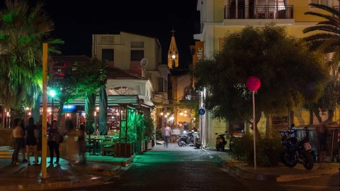 Mytilene / Greece - 09 10 2018: Busy bustling street tourism time lapse Summer night