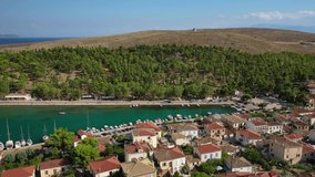 Aerial drone video from picturesque seaside fishing village and port of historic Galaxidi, Fokida, Greece