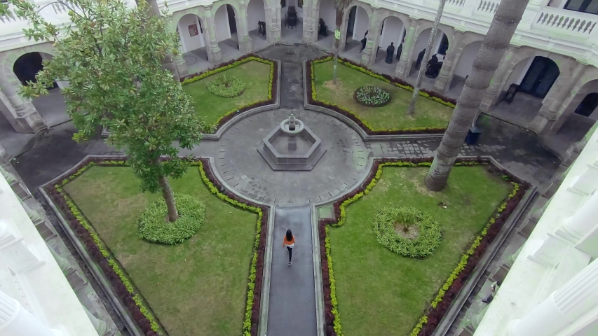 Young girl walking through the metropolitan cultural center in quito Ecuador