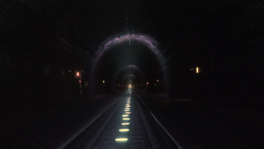 Extreme train coming towards camera in a railway tunnel. Representing achieving your goals, getting through problems and obstacles or problems seem bigger than they really are Royalty-Free Stock Footage #1034777420