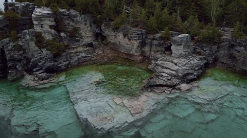 Aerial footage from drone with amazing view over intense blue water of Lake Huron and Bruce Peninsula, Ontario, Canada