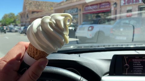 marbella , Ma / Spain - 04 29 2019: driving with ice cream good news story for summer
