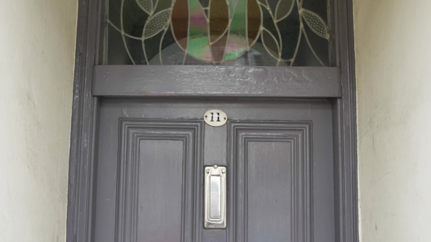 Generic house number on an entrance door.