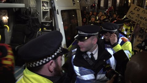London / United Kingdom (UK) - 01 15 2019: Officers put an arrested Yellow Vest into a police van