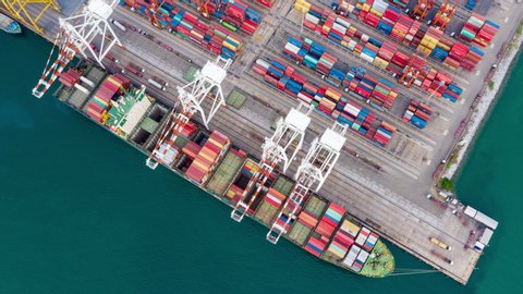 time lapse international cargo  container shipping port by the sea business aerial top view in Thailand