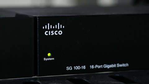 Phatthalung , THAILAND - AUGUST 4 2019 : Close up Cisco SG 100-16  , Gigabit Switch for small business with UTP cat6 network cable