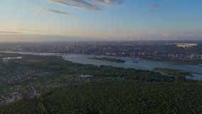 Aerial video of a large red arched bridge and river Ob in Novosibirsk, Russia. 